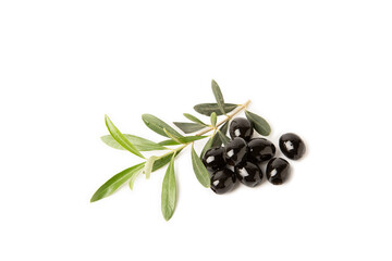 Black olives isolated on white background. Olive tree leaves. Vegan. Ingredient for salad or pizza.