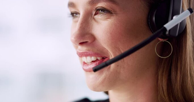 Call center, face and happy woman talking for customer service, telemarketing and CRM consulting. Closeup of female agent, communication and microphone to contact us, help desk and technical support