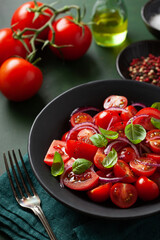 healthy tomato salad with onion basil olive oil and balsamic vinegar