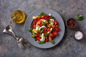 healthy colorful tomato mozzarella basil salad with balsamic vinegar dressing