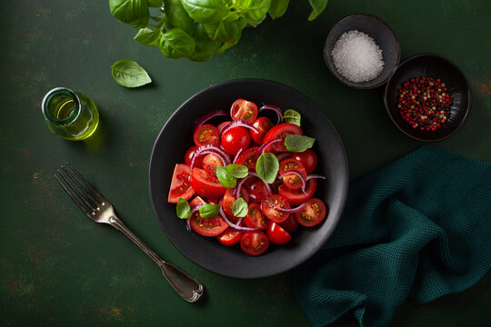 healthy tomato salad with onion basil olive oil and balsamic vinegar