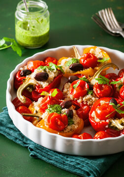 Stuffed Bell Peppers With Quinoa Tomatoes Olives And Herb Sauce Chimichurri