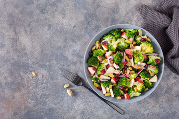 healthy broccoli salad with apple onion dried cranberries pistachio. vegan low carb diet