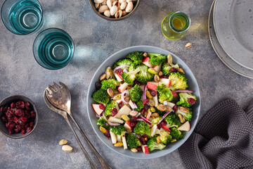 healthy broccoli salad with apple onion dried cranberries pistachio. vegan low carb diet