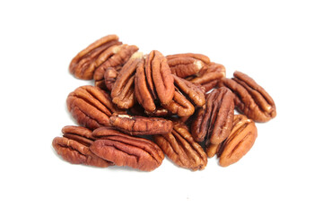 Heap of pecan nut halves isolated on a white . Peeled pecan nuts closeup