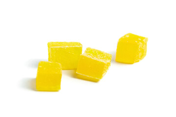 Diced mango dried fruits isolated on white background. Dehydrated mango chips dices