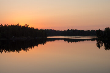 calm sunset on the forest lake