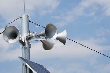 outdoor public address system consisting of five amplification megaphones