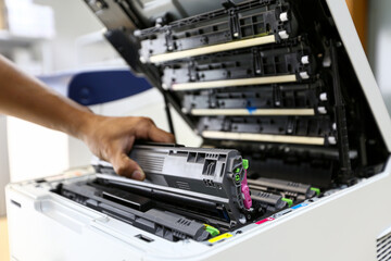 Technician hand open cover printer photocopier or photocopy to replace ink cartridges or fix paper...