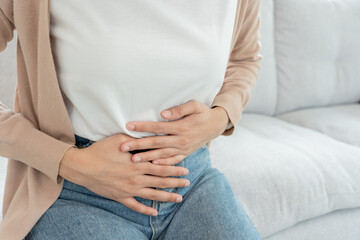 Constipation and diarrhea in bathroom. Hurt woman touch belly  stomach ache painful. colon...