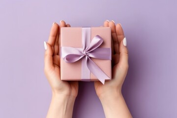 hands holding small gift with ribbon, AI generative