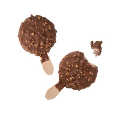 Milk chocolate and crushed almond nuts covered ice cream round on wooden stick, whole and bitten flying on white background.