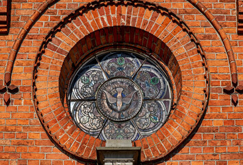 Fototapeta premium General view and close-up of architectural details of a cemetery chapel built in the second half of the 19th century in Czerwin, Mazovia, Poland.