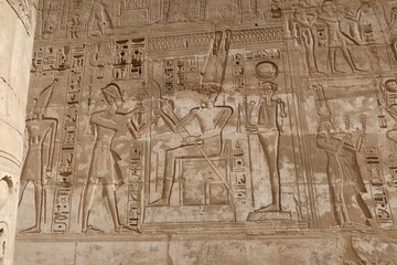 Inscriptions on the walls of the mortuary temple of Medinet Habu in Luxor in Egypt