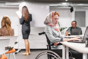 Fototapeta na wymiar Young girl in a wheelchair