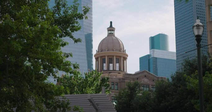 Establishing shot of the 1910 Harris County Courthouse and downtown Houston
