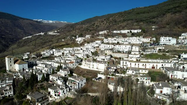 Aerial view above the beautiful villages of Capileira and Bubi&oacute;n in the gorge of the Poqueira in Andalusia Spain	