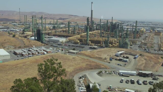 Large towers and pumps adorn the Benicia Oil Refinery in California