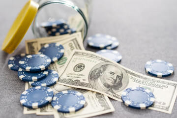 Blue poker chips on stock market chart background