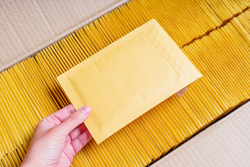 Shipping Box Full of Yellow Bubble Mailers