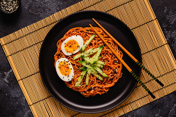 Korean traditional food, cucumber and boiled egg cold spicy noodles.