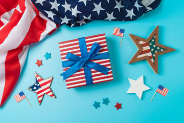 Happy Independence Day, 4th of July celebration concept with gift box, stars and USA flag on blue background. Top view, flat lay