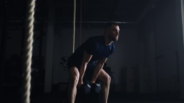 Man Training Alone In Gym, Doing Push-Ups And Lifting Dumbbells, Powerlifting And Bodybuilding