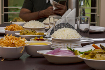 Authentic delicious bengali foods served in white pots.