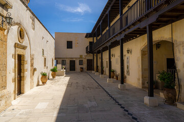 Fototapeta na wymiar Courtyard of Monastery of Our Lady of Gonia on the southeast coast of the Rodopos peninsula in Crete.