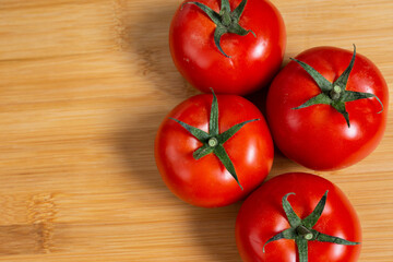 tomatoes back ground healthy food over a wood plate