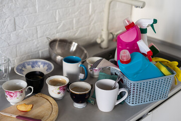 Cleaning service. Bucket with sponges, chemicals bottles and mopping stick. Rubber gloves and towel. Household equipment.