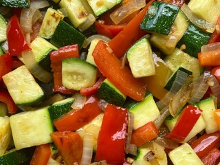 Colorful Mediterranean vegetable dish with diced peppers, zucchini and onions