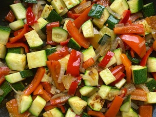 Colorful Mediterranean vegetable dish with diced peppers, zucchini and onions