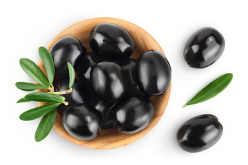 Black olives with leaves in wooden bowl isolated on a white background with full depth of field. Top view. Flat lay