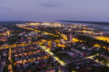 Fototapeta na wymiar Scenic aerial view of the Old town of Klaipeda, Lithuania in purple evening light. Klaipeda city port area and it's surroundings.