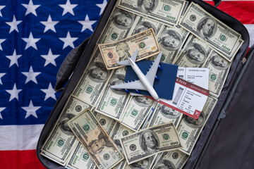 an old black suitcase with an open lid full of one hundred dollar bills. Corruption