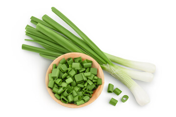 Green onion in wooden bowl isolated on the white background. Top view. Flat lay.