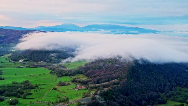 Moving clouds view from the top of mountain cliff edge