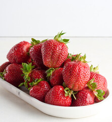 Ripe red strawberry on white background