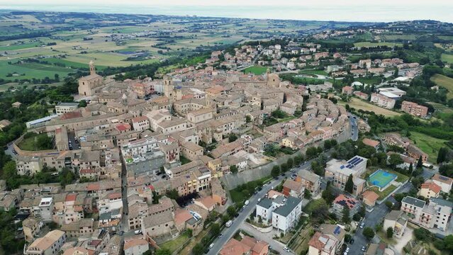 italy, june 2023 - aerial view of the medieval village of Potenza Picena in the province of Macerata in the Marche region. From the town you can see Mount Conero and the Adriatic Sea in the background
