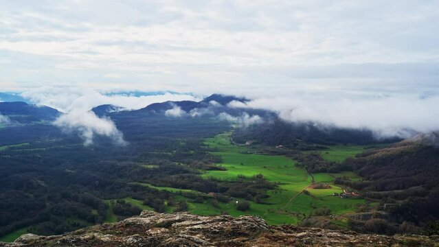 Moving clouds view from the top of mountain cliff edge (Cingle d'Aiats, Catalunya, Spain)