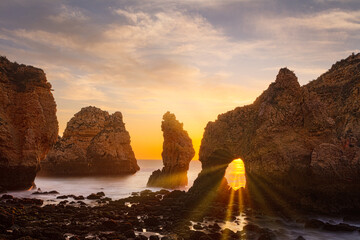 Sunrise at the Algarve cliff coast, Portugal