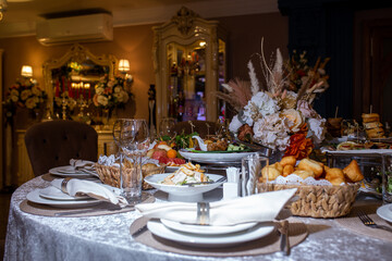 decorated table in the restaurant for the celebration. table with various dishes