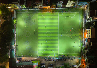 Aerial top view of people playing soccer football sport recreation field ground, national stadium...