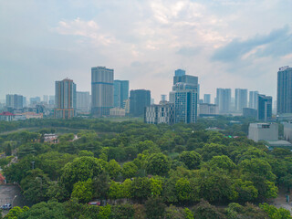 Aerial view of Hanoi Downtown Skyline with green garden park, Vietnam. Financial district and business centers in smart urban city in Asia. Skyscraper and high-rise buildings.