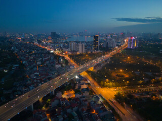 Fototapeta na wymiar Aerial view of Hanoi Downtown Skyline, Vietnam. Financial district and business centers in smart urban city in Asia. Skyscraper and high-rise buildings at night.