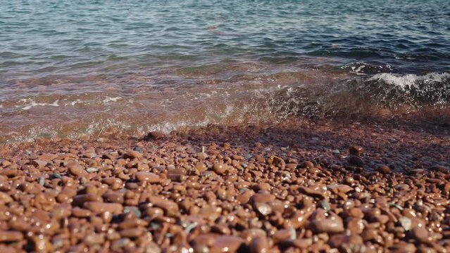 Slow motion closeup shot of clear sea water on Saint Raphael beach