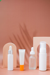 summer beauty product on a summer background. skincare and cosmetic concept with tropical leaf shadow.