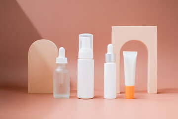 beauty product for summer. mock-up skincare container with sunscreen on a pastel display background.