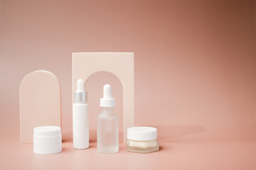 beauty product and mock-up skincare container on a pastel display background. 